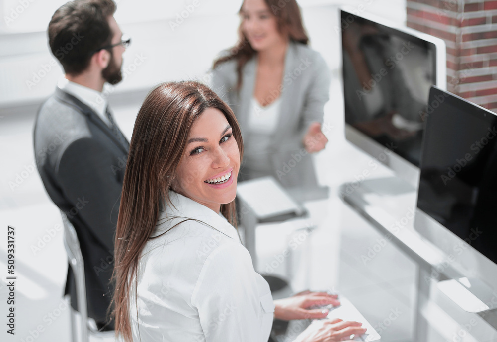 Canvas Prints young employee sitting at his Desk