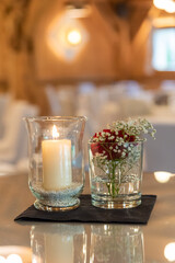 floral decoration with a candle at a wedding