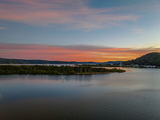 High cloud sunrise at the waterfront
