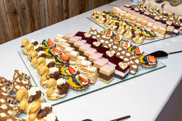 plates filled with pieces of different cakes