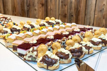 plates filled with pieces of different cakes