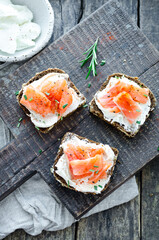 Healthy breakfast - toast with rye bread, salmon and cream cheese