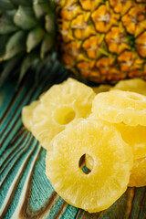 delicious dried pineapple on a wooden rustic background