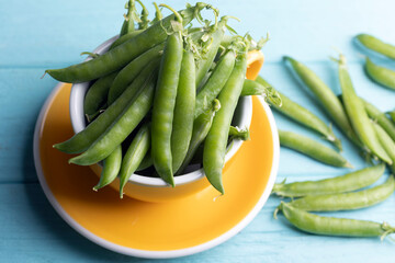 green peas in a yellow bowl