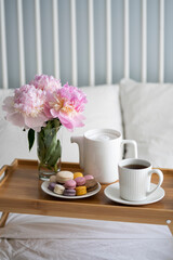 Tray with breakfast on bed.