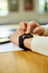 Unrecognizable woman using smartwatch, Freelancer female with smart watch