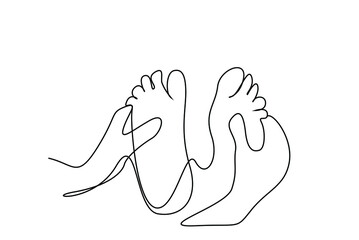 a specialist rubs and massages the soles of a person feet