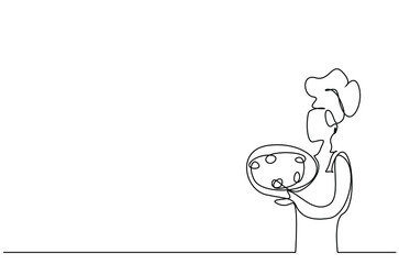 a cook holding large tray posing positive beautiful