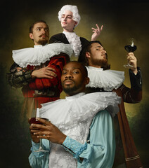 Medieval people as royalty persons in vintage clothing tasting red wine on dark vintage background....