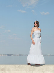 Fototapeta na wymiar young slender woman by the sea