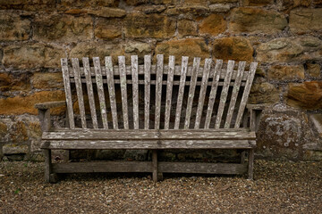 Old wooden bench with vertical back slats