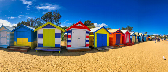 Fototapeta premium Brighton Beach, Australia - September 7, 2018: Brighton Beach colorful wooden cabins on a sunny day, panoramic view