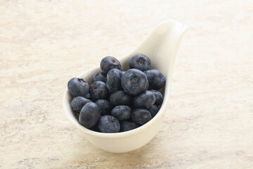 Sweet ripe blueberry heap in the bowl