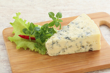 Blue cheese piece over board