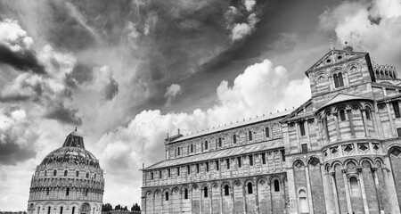 Pisa. Baptistery and Cathedral in Mirecles Square with dramatic sky