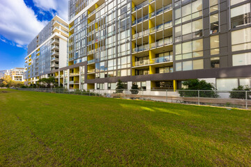 Fototapeta na wymiar Residential high rise apartment building in inner Sydney suburb NSW Australia. Residential complex in leafy suburbia. Urban living high density suburban city 