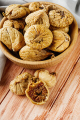 delicious dried figs on a wooden rustic background