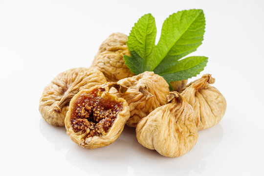delicious dried figs on a white acrylic background