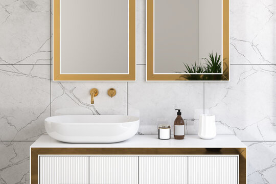 Close up of luxury sink with square mirrors are hanging in on white marble wall, modern cabinet with gold faucets in minimalist bathroom. 3d rendering
