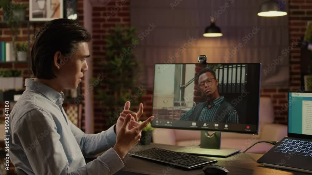 Wall mural company employee meeting with manager on online videocall, using computer webcam to chat on remote v
