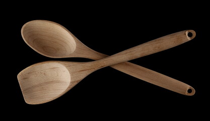 Empty spoons, isolated on black, top view 