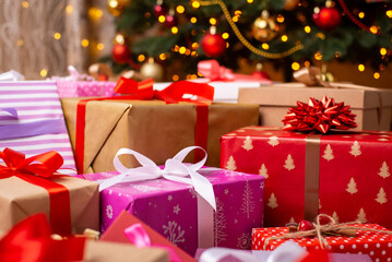 Different beautiful Christmas presents under the Christmas tree. Christmas celebration concept
