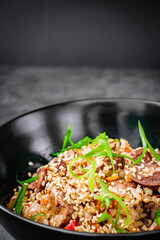 traditional chinese fried rice on black background