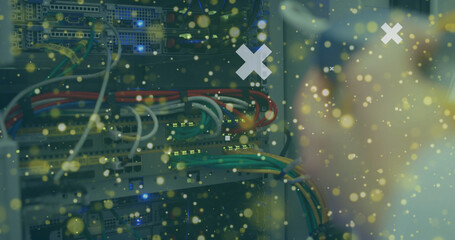 Image of digital heart icons over server room