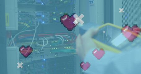 Image of digital heart icons over server room