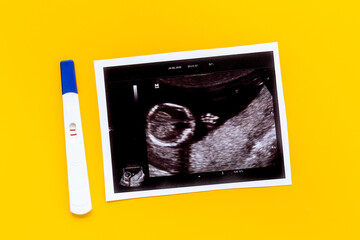 Ultrasound picture of unborn baby with positive pregnancy test