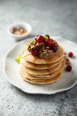 Homemade pancakes with berries and nuts