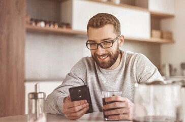 close up. man reading e-mails during Breakfast