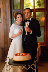 Wedding cake 40 year old bride and groom in a restaurant