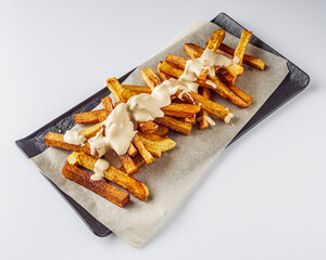 golden french fries on a white acrylic background