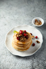 Homemade pancakes with berries and nuts