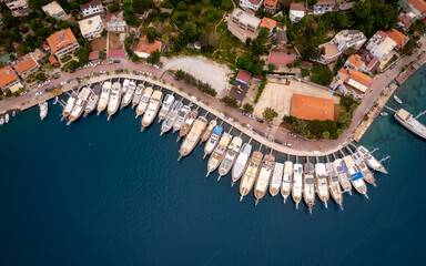 Boats anchored in small town's port (aerial drone photo). Near Marmaris, Turkey