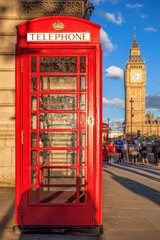 Red Phone Booths against famous Big Ben in London, England, UK