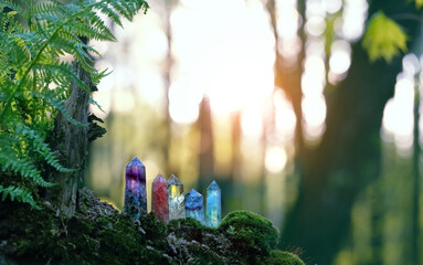 Gemstones crystal towers on mysterious forest natural abstract background. minerals for esoteric...