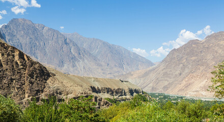 Gilgit river, tributary of the Indus river, flowing through the beautiful mountain valley in the Karakorum mountains in Pakistan