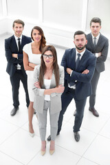business woman standing in front of business team.