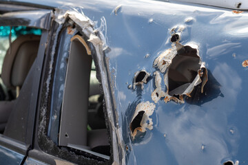 Car riddled with bullets. War of Russia against Ukraine. A car of civilians shot by the Russian...