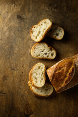 Traditional homemade baguette bread on a wooden table
