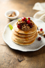 Homemade pancakes with berries and nuts
