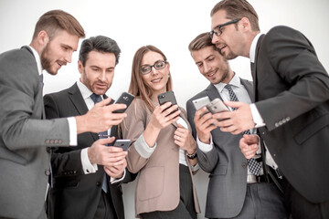 group of business people reading a message on phones