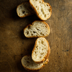 Traditional homemade baguette bread on a wooden table