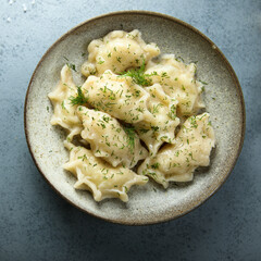 Homemade potato dumplings with dill