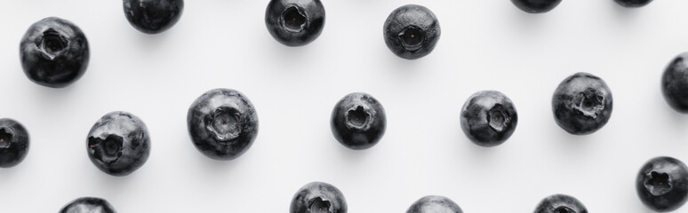 Flat lay with fresh blueberries on white background, banner.