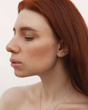 Bright, summer portrait of a girl with red hair without makeup