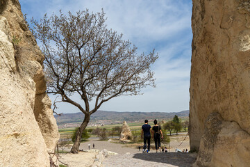 A couple on vacation in Pasabag Monks Valley Cappadocia. Popular travel destination in Turkey. 