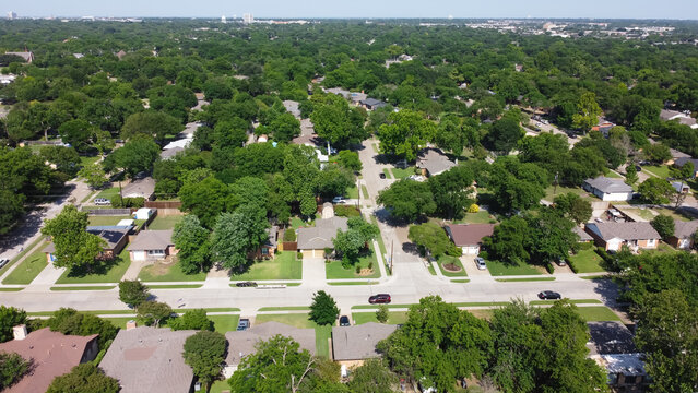 Established residential neighborhood with lush greenery to horizontal aerial view Richardson, Texas, USA